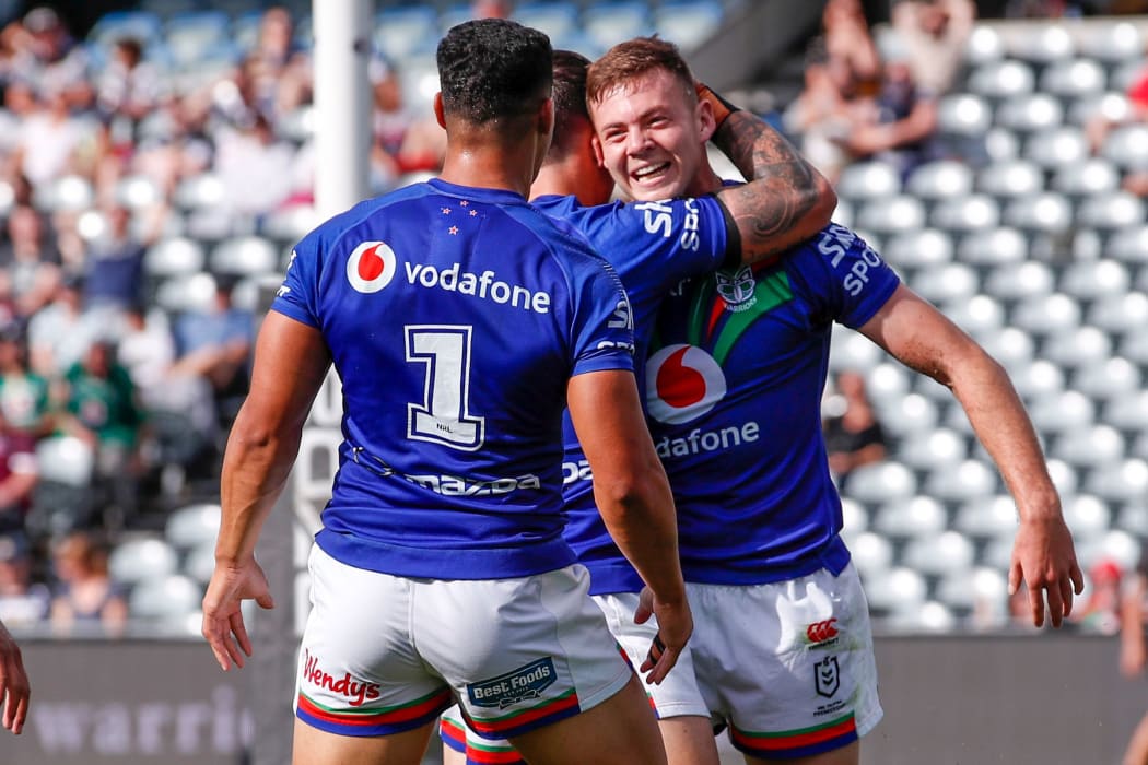 Rocco Berry celebrates with teammates after scoring.