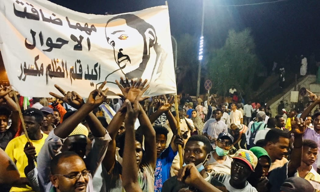 KHARTOUM, SUDAN - APRIL 10: Sudanese protesters, demanding the resignation of Sudanese President Omar Al-Bashir, stage a demonstration against high cost of living, fuel and cash shortage in front of army headquarters building in Khartoum, Sudan.