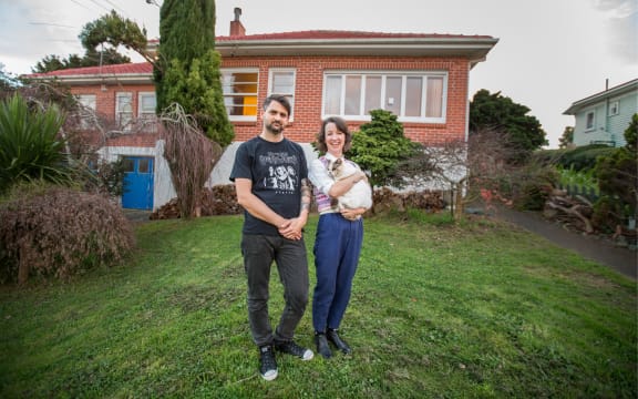 Stu Harwood and Jenna Todd outside their rented house in Mount Roskill, Auckland