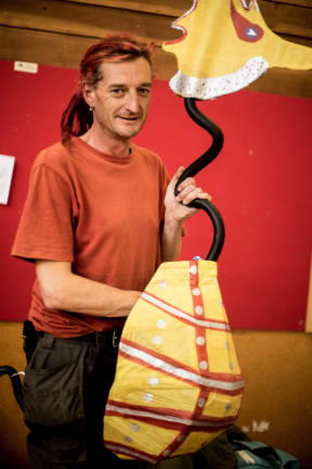 Jim Richards with a seahorse made from recycled cardboard and bicycle handlebars