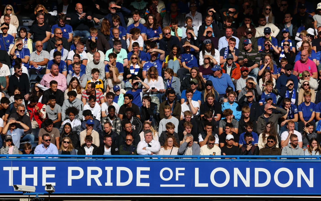 Chelsea fans looking on from the stands at Stamford Bridge.