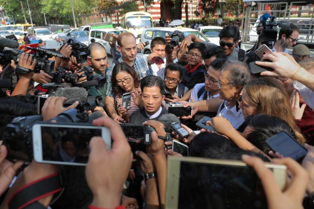 Than Zaw Aung (C), lawyer of jailed Myanmar journalists Wa Lone and Kyaw Soe Oo speaks to journalists  in Yangon on January 11, 2018.  AFP