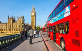 LONDON, UK - SEPTEMBER 28, 2015: Tourists on Westminster Bridge at the Houses of Parliament aka Westminster Palace (HDR). london generic