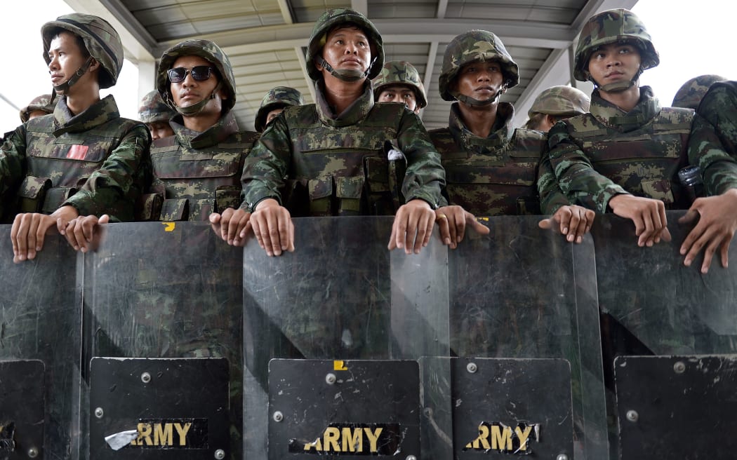 Thai soldiers after they sealed off an elevated train station leading to a shopping mall in downtown Bangkok.