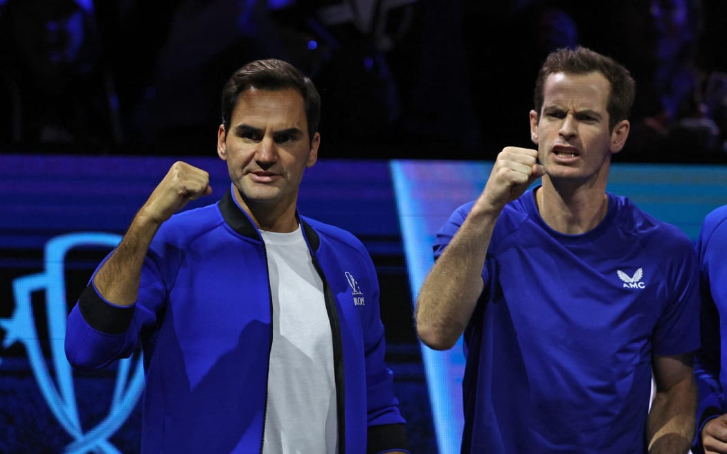 Switzerland's Roger Federer (L) and Britain's Andy Murray (R) react during the match between Greece's Stefanos Tsitsipas of Team Europe and USA's Frances Tiafoe of Team World during their 2022 Laver Cup men's singles tennis match at the O2 Arena in London on 25 September 2022.