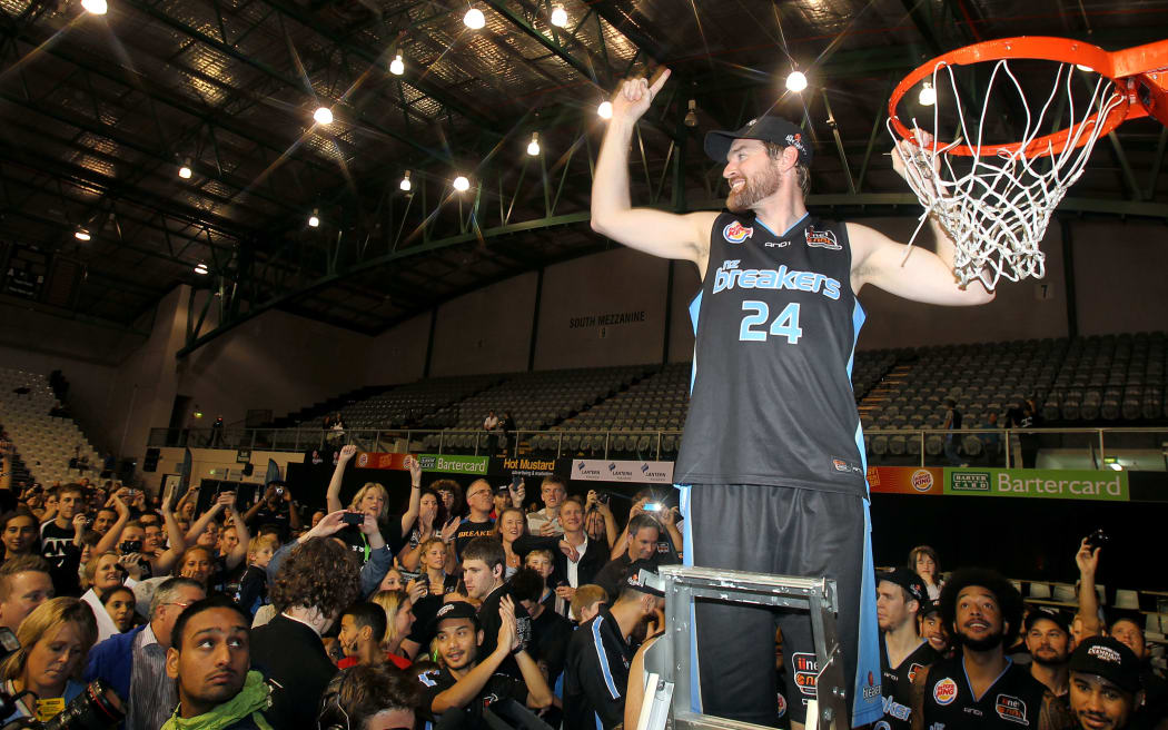 Breakers' Dillon Boucher cuts the net after winning the ANBL, Grand Final Game 3 against Cairns Taipans in 2011.