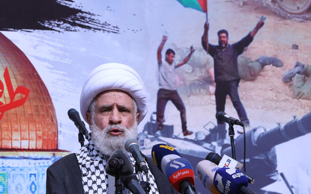 The deputy chief of Lebanon's Shiite militant group Hezbollah, Sheikh Naim Qassem, delivers a speech during a rally in Beirut on October 13, 2023, as thousands of protesters poured onto the streets of several Middle East capitals in support of Palestinians amid Israeli air strikes on Gaza in reprisal for a surprise Hamas attack. Thousands of people, both Israeli and Palestinians have died since October 7, 2023, after Palestinian Hamas militants entered Israel in a surprise attack leading Israel to declare war on Hamas in the Gaza Strip on October 8. (Photo by ANWAR AMRO / AFP)