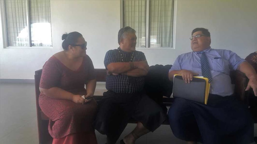 Anoanoa'i Pepe on left Mata'afa Sepelini middle talking to their lawyer after the veridict