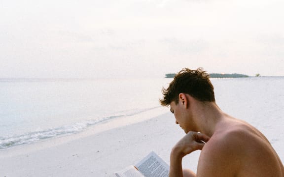 young man reading