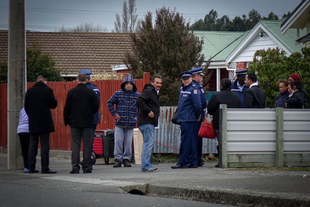 Community members known to the deceased enter the property where their bodies lie.