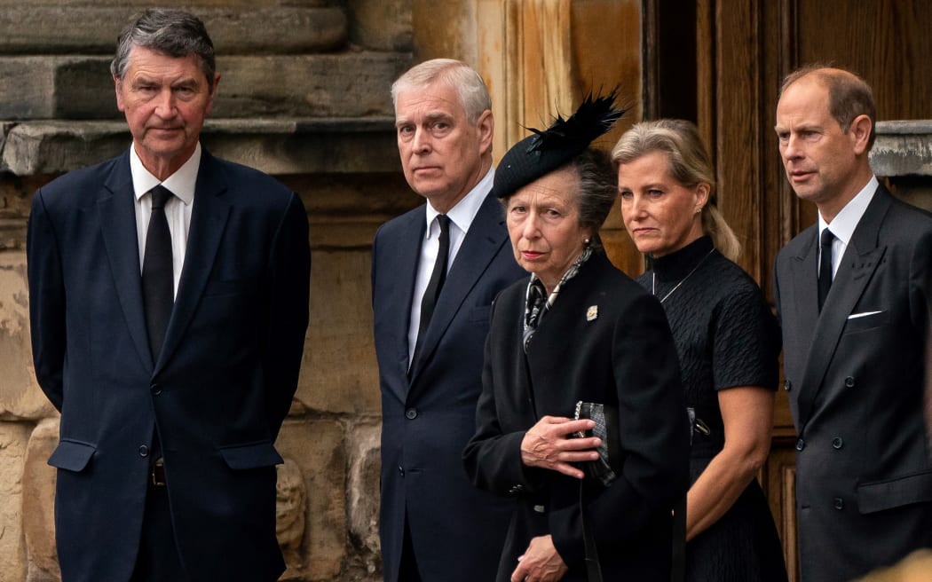 Vice Admiral Timothy Laurence (L) Britain's Prince Andrew, Duke of York (2L), Britain's Princess Anne, Princess Royal (C), Britain's Sophie, Countess of Wessex (2R) and Britain's Prince Edward, Earl of Wessex await the arrival of the hearse carrying the coffin of the late Queen Elizabeth II, at the Palace of Holyroodhouse, in Edinburgh on September 11, 2022.