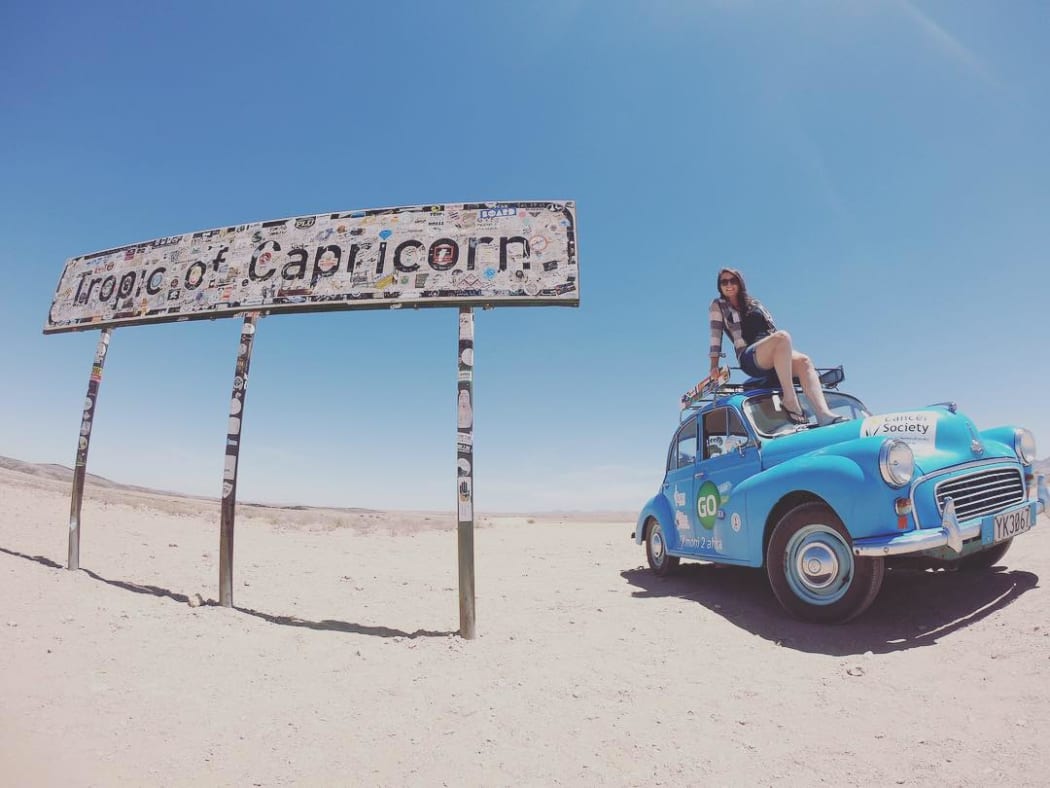 Laura Morrison and her 1958 Morris Minor 1000 which she drove from Aberdeen to Cape Town.
