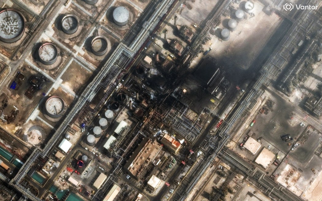 This handout satellite image from Vantor taken and released on March 2, 2026, shows damage at the Saudi Aramco's Ras Tanura refinery. Saudi Arabia's military raised its readiness levels after multiple attacks by Iran, a source close to the army told AFP on March 2, while another warned of a possible military response if its oil infrastructure is targeted. The massive Ras Tanura refinery on Saudi Arabia's Gulf coast went into partial shutdown on March 2 after a strike by drones, three days into the Middle East war.