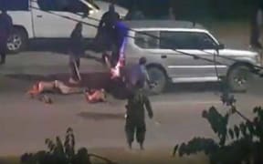 Screenshot of Papua New Guinean police officers violently beating three men on a street in Port Moresby, Papua New Guinea shared on social media on November 4, 2019.