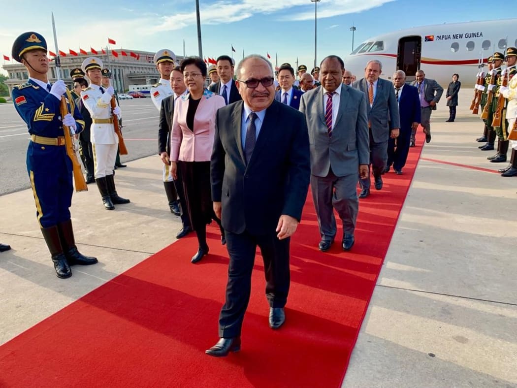 Papua New Guinea's prime minister Peter O'Neill arrives in Beijing for a 'Belt and Road' summit, 25 April 2019.