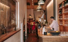 Gatlin Avery, who's the front of house manager at Bar Celeste.