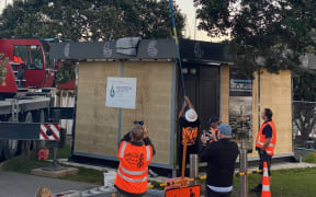Whangārei's "world-unique" running-ball clock sculpture being craned into place.