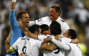 All Whites keeper Mark Paston celebrates victory with his team-mates after their victory over Bahrain, Wellington, 2009.