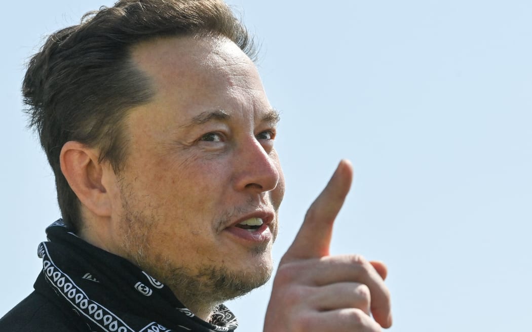 US entrepreneur and business magnate Elon Musk gestures during a visit at the Tesla Gigafactory plant under construction, on August 13, 2021 in Gruenheide near Berlin, eastern Germany. (Photo by Patrick Pleul / POOL / AFP)