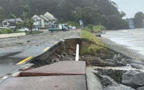 Huge swells triggered by ex-Cyclone Tam washed away part of the waterfront in Paihia, exposing cables and a water main.