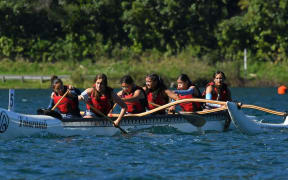 Tauranga Girls' College students in action at the Secondary School Waka Ama Nationals on Blue Lake in Rotorua.