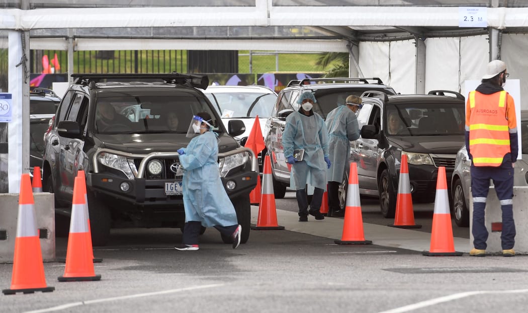 People queue for Covid-19 coronavirus tests in the Melbourne suburb of St Kilda