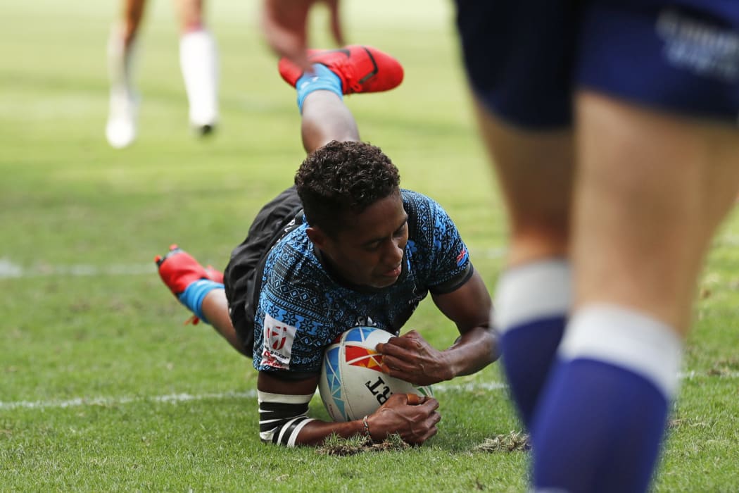Fiji's Luisa Tisolo scores in the fifth place playoff against England.