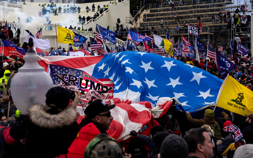 WASHINGTON, DC - JANUARY 6: Trump supporters clash with police and security forces as people try to storm the US Capitol on January 6, 2021 in Washington, DC. Demonstrators breeched security and entered the Capitol as Congress debated the 2020 presidential election Electoral Vote Certification. (photo by Brent Stirton/Getty Images) (Photo by BRENT STIRTON / GETTY IMAGES NORTH AMERICA / Getty Images via AFP)