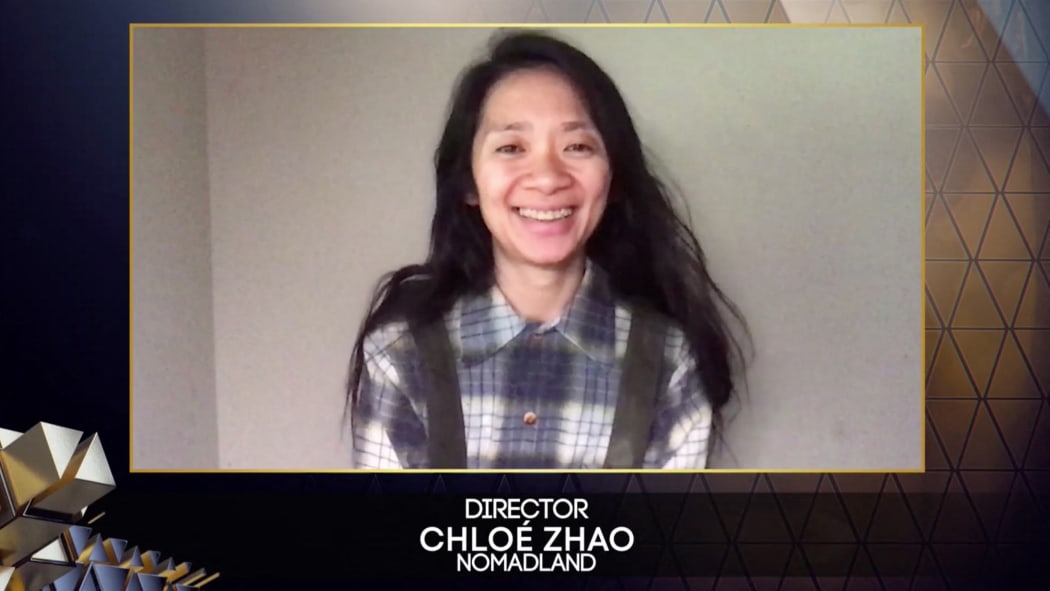Chinese-born director Chloé Zhao reacting after winning best director for her work on the film 'Nomadland', via video link, at Britain's BAFTA awards, 11 April 2021. April 11, 2021.