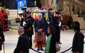 Members of the public file past as King Charles III, Princess Anne, Prince Edward and Prince Andrew attend a Vigil at St Giles' Cathedral, in Edinburgh, on 12 September 2022, where the coffin of Queen Elizabeth II lies in rest.