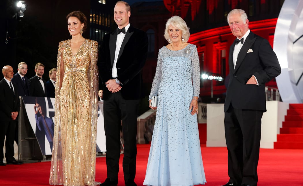 Britain's Prince William, Duke of Cambridge (2L) and  Catherine, Duchess of Cambridge (L) Prince Charles, Prince of Wales (R) and Britain's Camilla, Duchess of Cornwall as they arrive for the World Premiere of t "No Time to Die" at the Royal Albert Hall  on September 28, 2021. -
