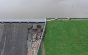 A handout aerial picture released by Derbyshire Constabulary on August 1, 2019 shows damage to the Toddbrook Reservoir dam above the town of Whaley Bridge in northern England on August 1, 2019.