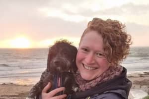 Meredith Woolsey and her dog Macduff after a walk in wet weather.
