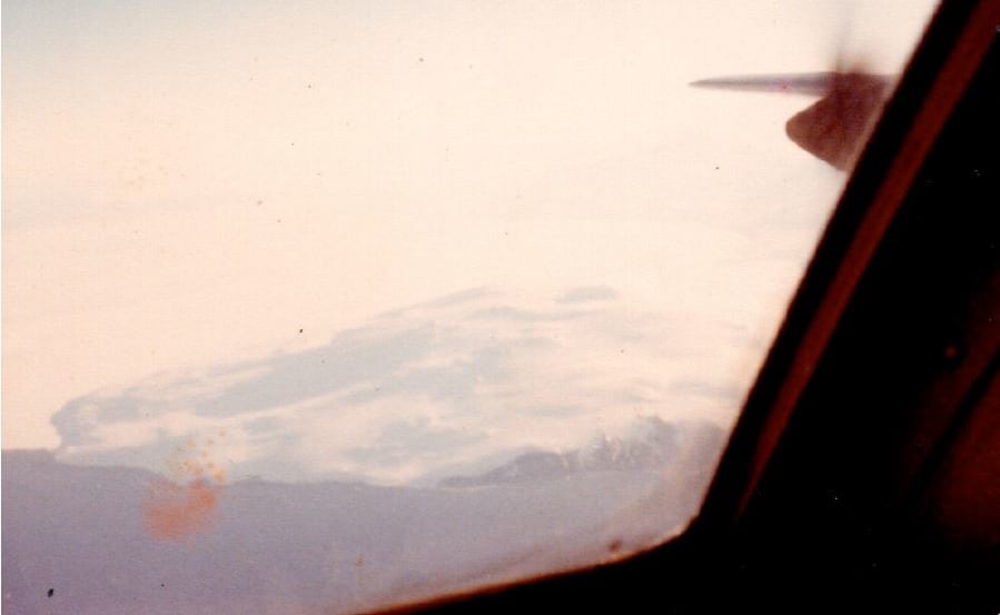 Flight Lieutenant Ray Robinson  took this photo of Mt Erebus out the cockpit window as the Hercules left to come home.