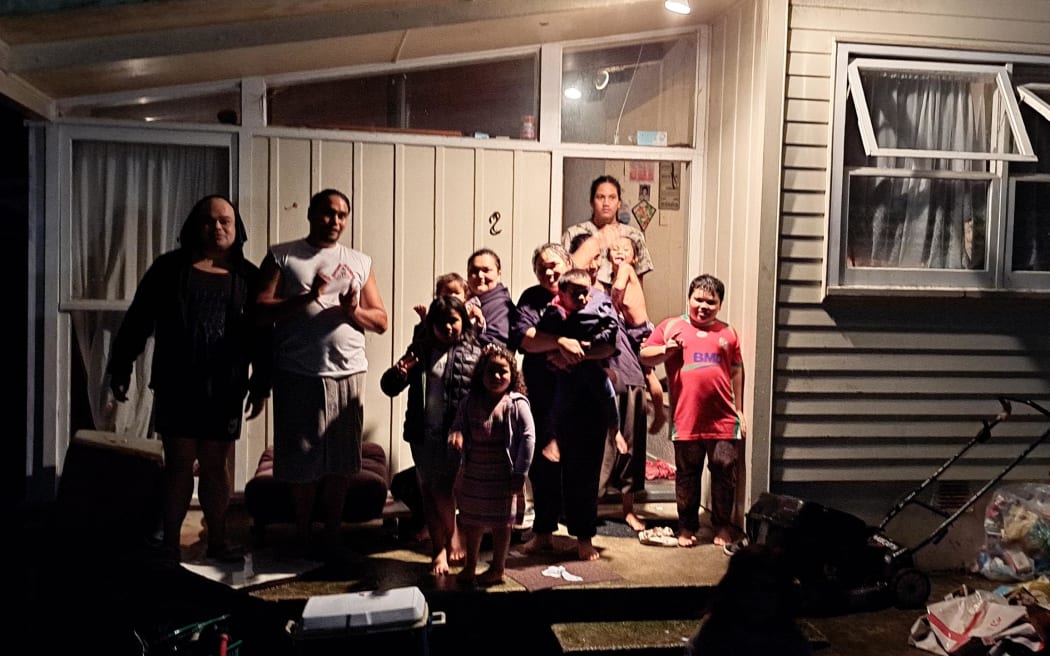 Neighbours on Clover Drive in Henderson get together in house that isn't flooded