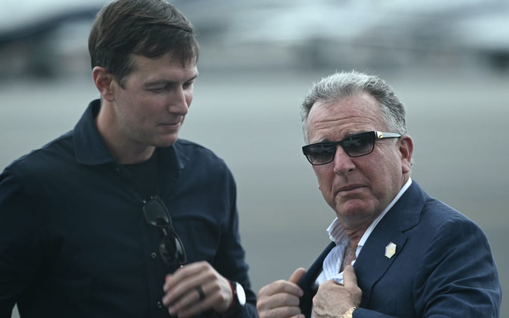 US special envoy to the Middle East Steve Witkoff (R) and Jared Kushner await the arrival of President Donald Trump and First Lady Melania Trump at Teterboro Airport in Teterboro, New Jersey, from where they will motorcade to attend the 2025 FIFA Club World Cup final football match between England's Chelsea and France's Paris Saint-Germain at MetLife Stadium in East Rutherford, New Jersey, on July 13, 2025. (Photo by Brendan SMIALOWSKI / AFP)