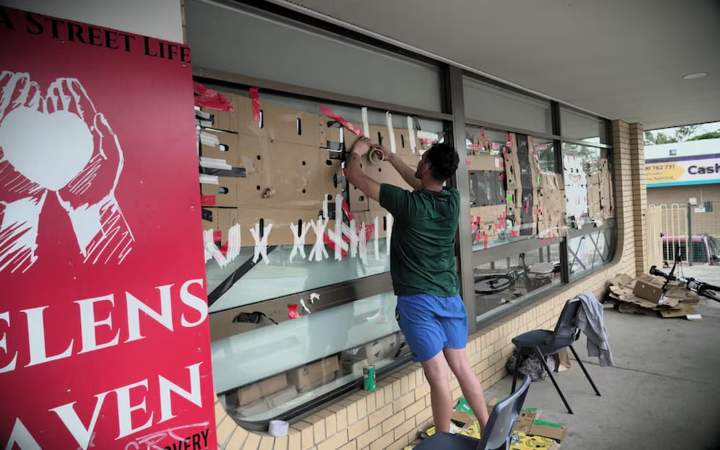 Goodna Street Life in Ipswich has put cardboard on their windows in the hope it'll stop any damage from loose objects.