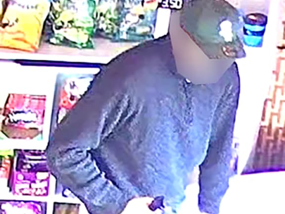 CCTV image of a man in relation to an ongoing homicide investigation in Northland. The images were edited by NZ Police around the man's face before publication by media.