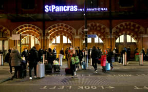 People waiting at St Pancras International train station in London before the travel restriction imposed by France on travelers from the UK to prevent the spread of the Omicron variant of Covid-19 on 17 December 2021.