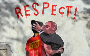 Picture shows a mural by Italian street artist Salvatore Benintende aka TvBoy which depicts Spanish Football Federation President Luis Rubiales kissing Spain midfielder Jenni Hermoso, in Barcelona on September 1, 2023. Spain's sports court has agreed to investigate Luis Rubiales for forcibly kissing star player Jenni Hermoso, after the Women's World Cup final match in Sydney, paving the way for fresh sanctions against the scandal-hit football boss, sources close to the case said today. (Photo by Pau BARRENA / AFP) / RESTRICTED TO EDITORIAL USE - MANDATORY MENTION OF THE ARTIST UPON PUBLICATION - TO ILLUSTRATE THE EVENT AS SPECIFIED IN THE CAPTION