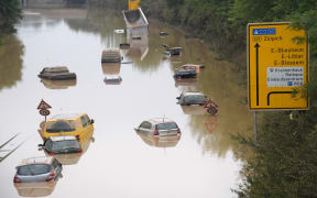 Submerged cars and other vehicles are seen on the federal highway B265 in Erftstadt, western Germany.