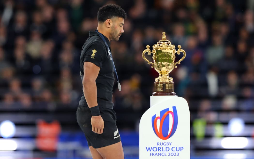 Richie Mo'unga walks past the World Cup after losing the final to the Springboks, 2023.
