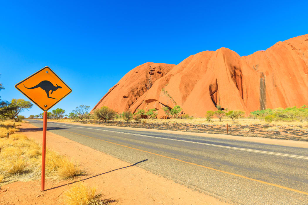 Kangaroo crossing warning sign along Ayers Rock drive in Uluru-Kata Tjuta National Park, UNESCO World Heritage Site, Northern Territory, Australia, Pacific