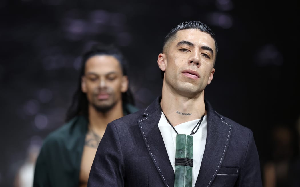 AUCKLAND, NEW ZEALAND - AUGUST 29: Singer Teeks walks the runway during the Kiri Nathan show during New Zealand Fashion Week 23: Kahuria at Viaduct Events Centre‎ on August 29, 2023 in Auckland, New Zealand.
