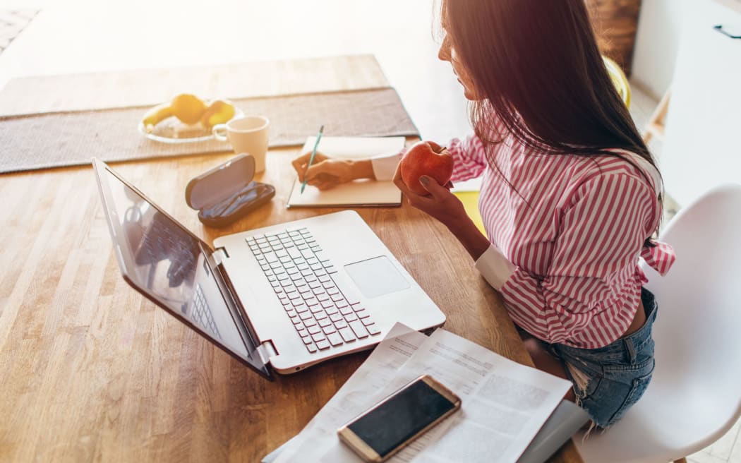 Young woman at home planning family budget and finances
