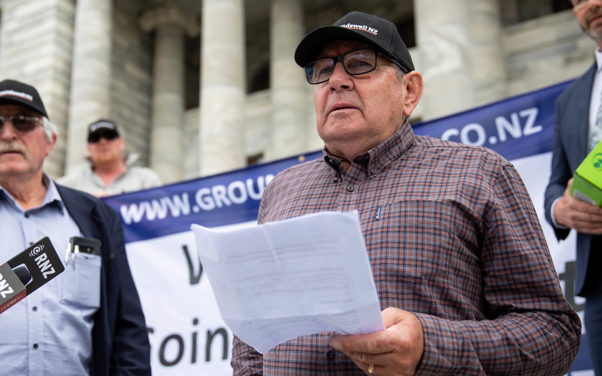 Representatives from Groundswell NZ deliver a petition to Parliament against the emissions trading scheme.