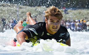 Zane Schweitzer paddles to victory