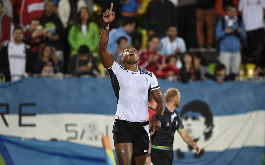 Fiji's Leone Nakarawa celebrates scoring a try in the men’s rugby sevens gold medal match between Fiji and Britain during the Rio 2016 Olympic Games at Deodoro Stadium in Rio de Janeiro on August 11, 2016