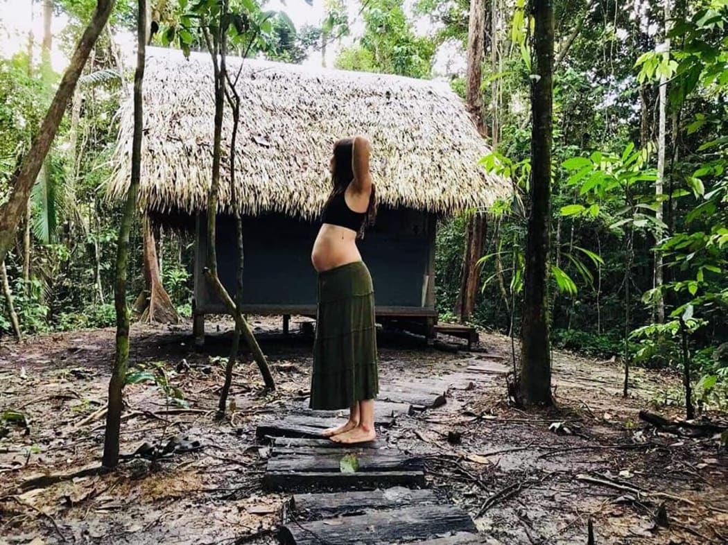 Lena Schulte near her home in the middle of the Amazon rainforest, just weeks before giving birth.