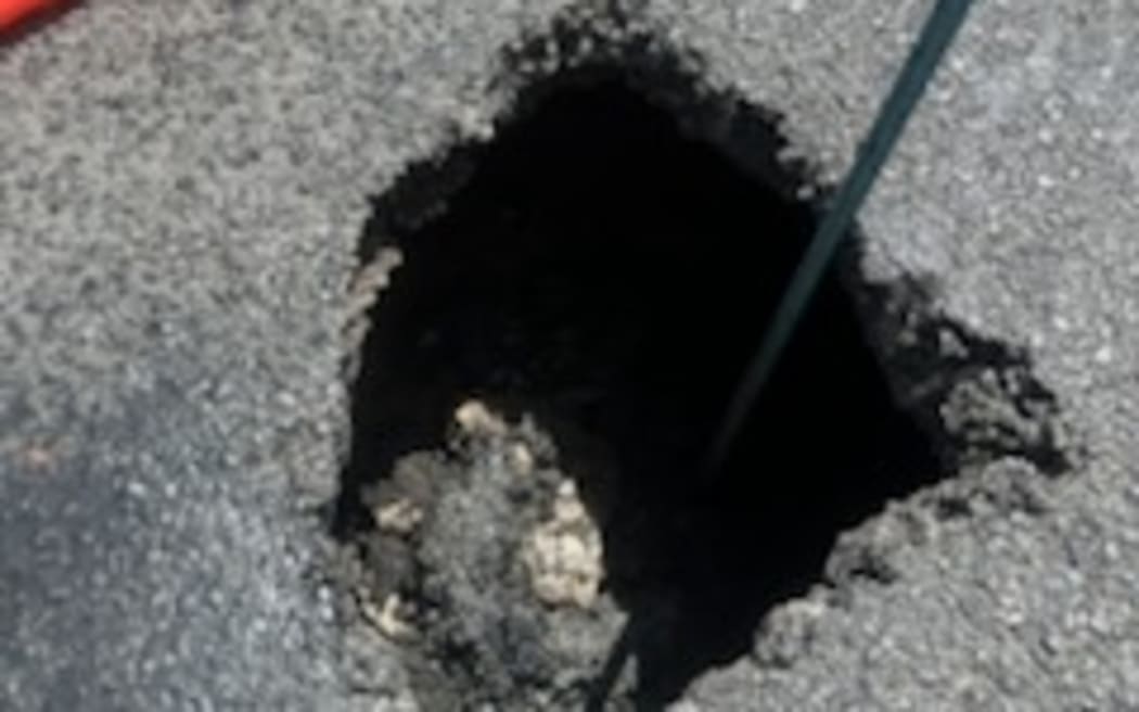 A stretch of highway south of New Plymouth is closed to southbound traffic until later tonight after a tomo, or sinkhole opened up.